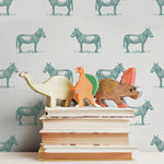 illustrated green jade donkey on white background wallpaper pattern behind stack of books peel and stick