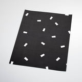 white confetti design on black background Removable Peel and Stick Wallpaper sample size