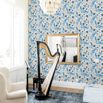 blue and orange leaves and flowers pattern on light blue background Removable Peel and Stick Wallpaper in living room