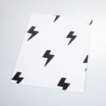 cartoon style black lightning design on white background wallpaper peel and stick pattern sample size