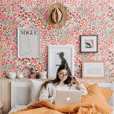 orange pink red and green meadow design pattern on light pink background Removable Peel and Stick Wallpaper in bedroom