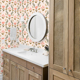 pink tan and dark green floral design pattern on peach colored background Removable Peel and Stick Wallpaper in bathroom