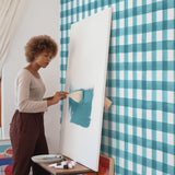 White background teal crosshatch pattern wallpaper in room with artist peel and stick removable