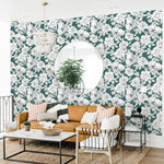 black and white outlined floral design pattern on forest green background Removable Peel and Stick Wallpaper in living room